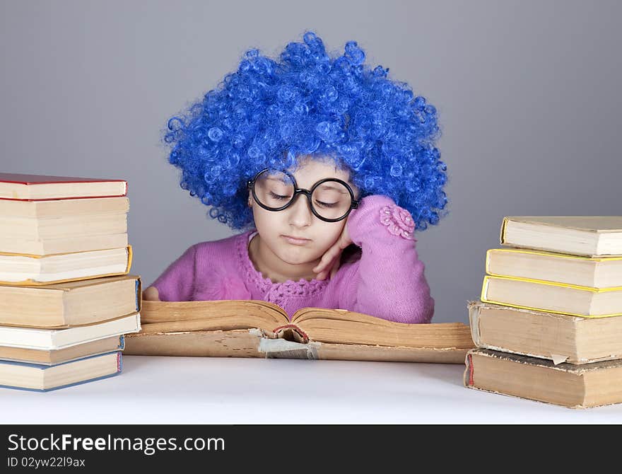 Young blue-haired girl with books.