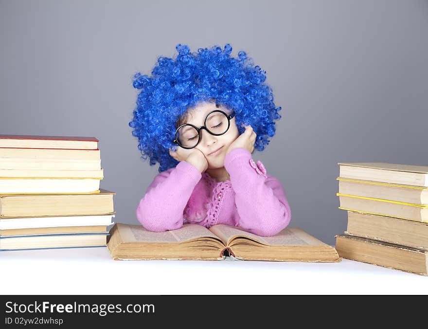 Young blue-haired girl with books.