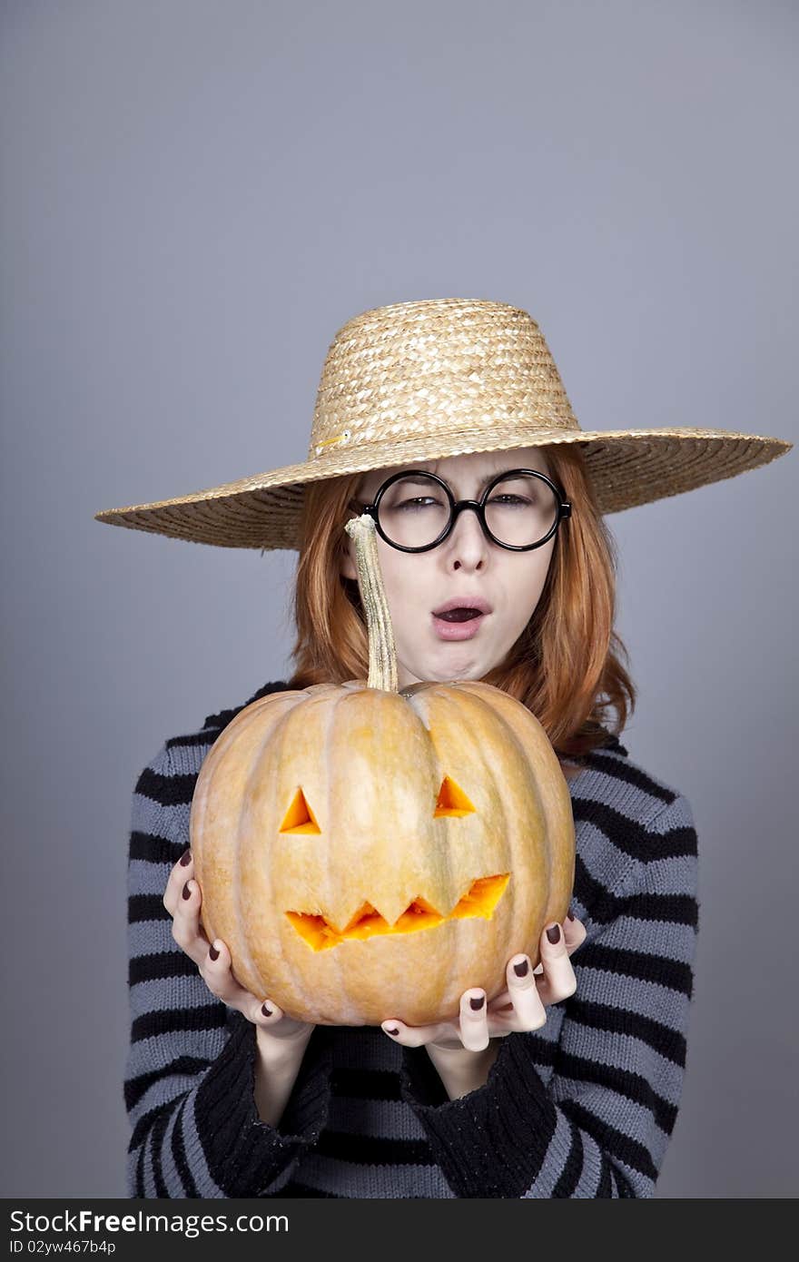 Funny Girl In Cap Showing Pumpkin.