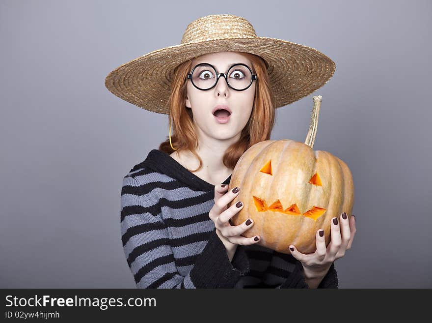 Funny Girl In Cap Showing Pumpkin.