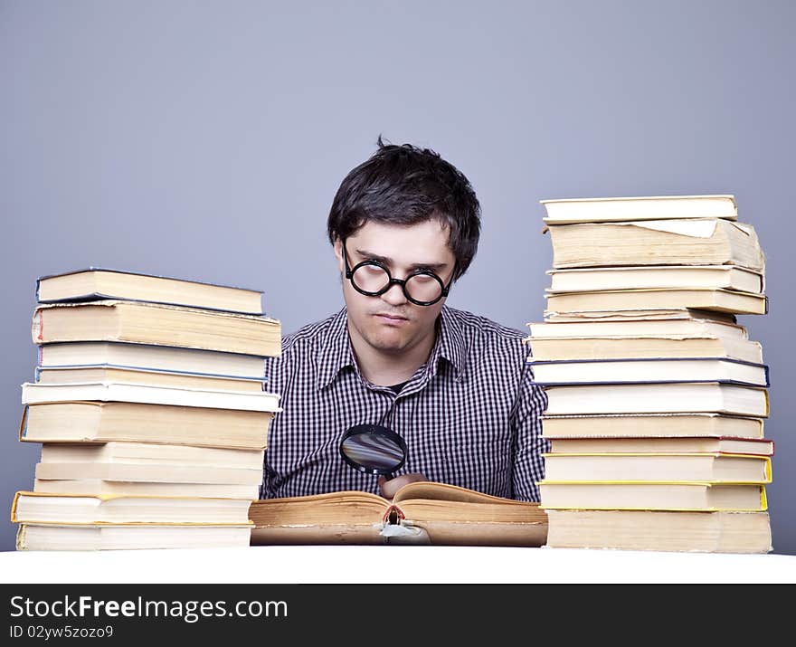 The young student with the books isolated. Studio shot.