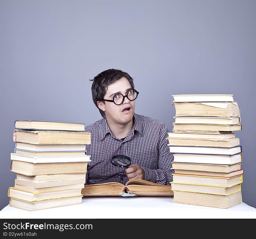 The young student with the books isolated. Studio shot.