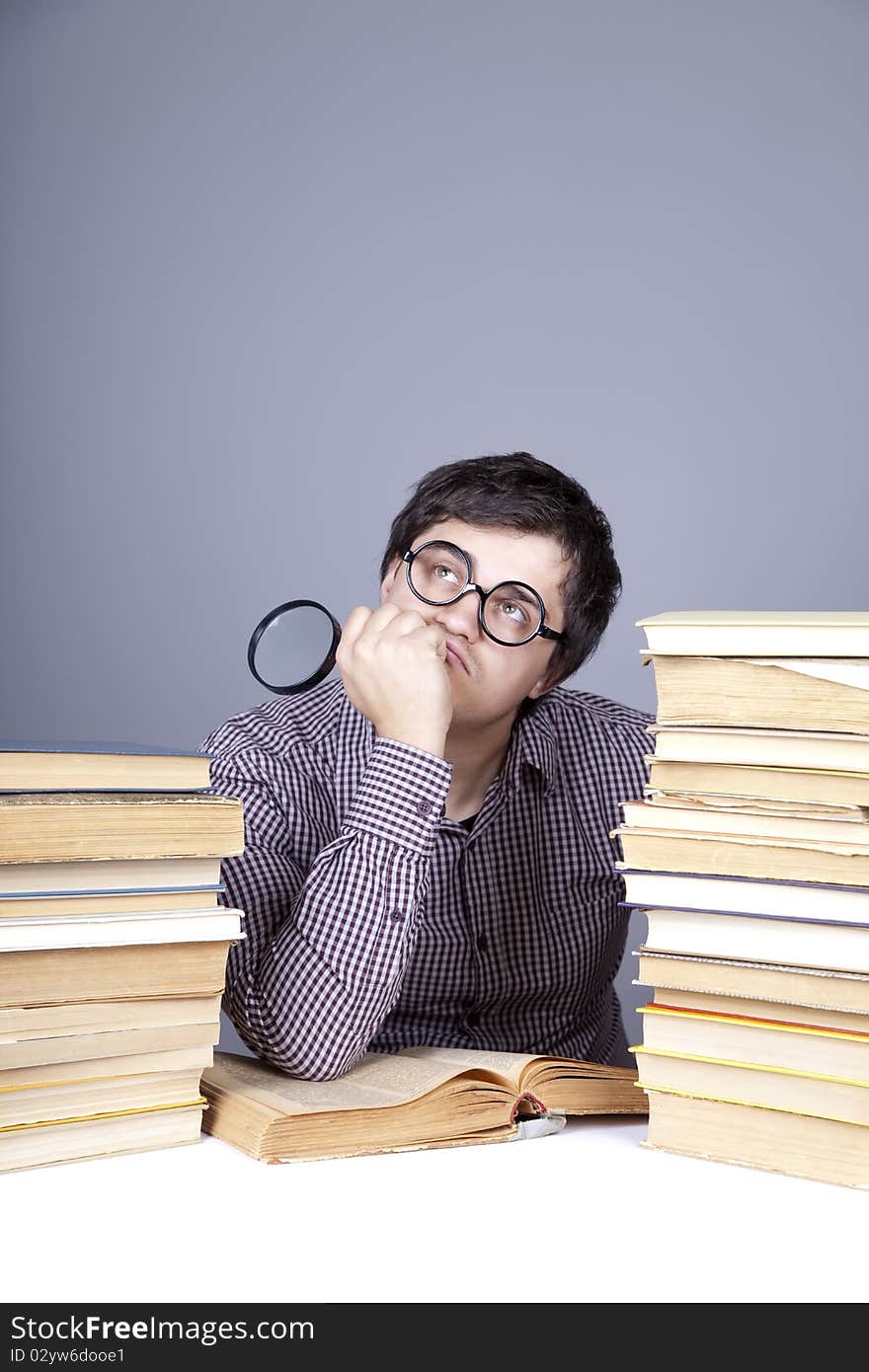 The young student with the books isolated. Studio shot.