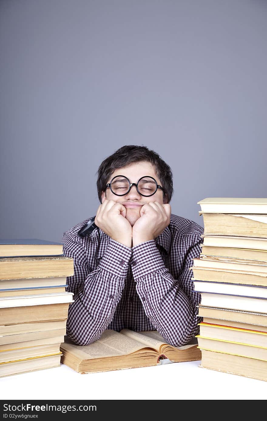 The young student with the books isolated. Studio shot.