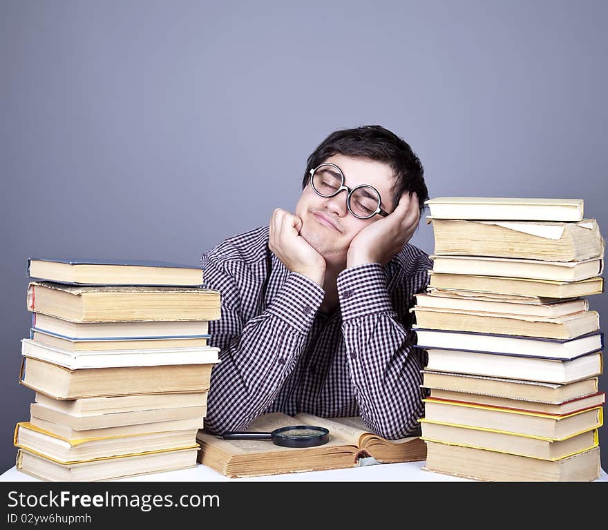 The young student with the books isolated. Studio shot.