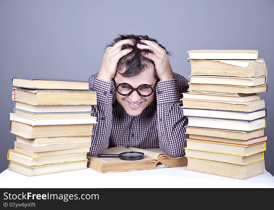 The young student with the books isolated. Studio shot.