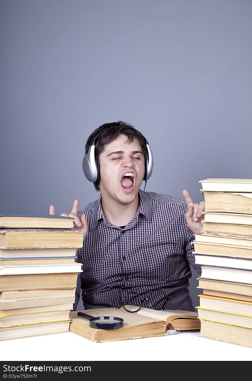 The young student with the books isolated. Studio shot.