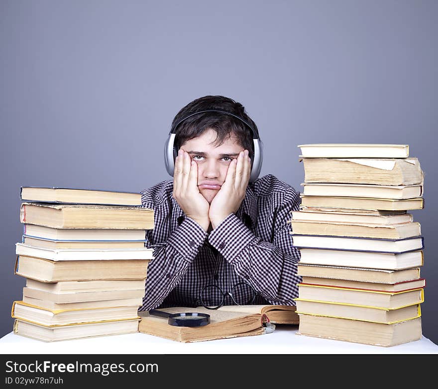 Student with the books and headphone isolated.