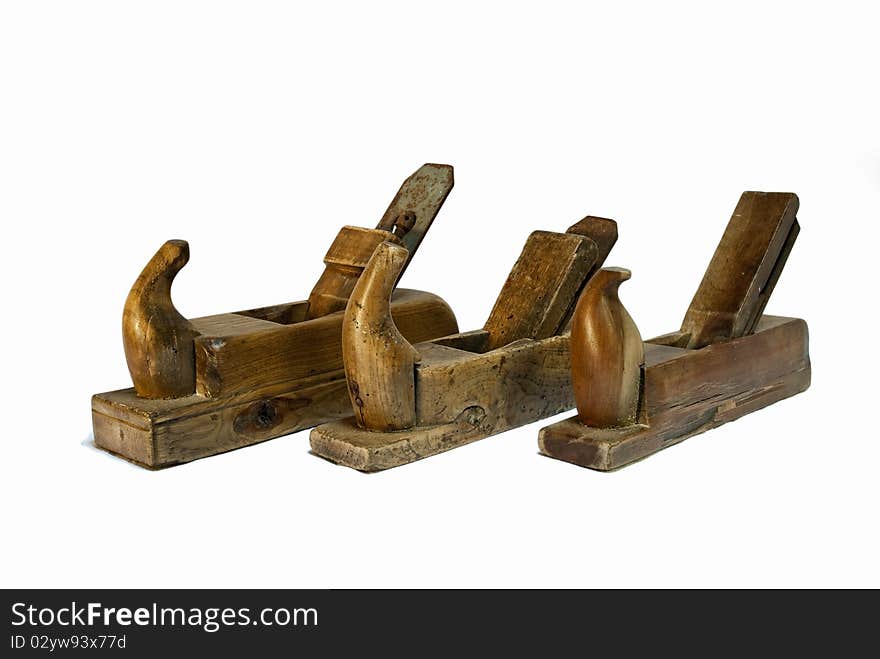 Three isolated and old jack planes on a white background