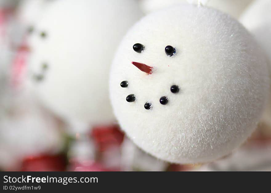 Cute smiling snowman face holiday ornament. Cute smiling snowman face holiday ornament