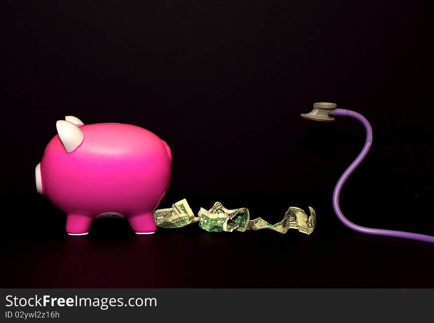 Piggy bank trailing dollar bills and is being chased by a stethoscope. Piggy bank trailing dollar bills and is being chased by a stethoscope.