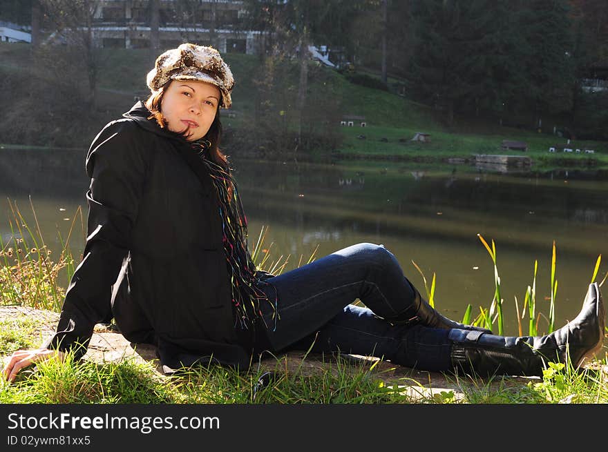 Girl in the autumn park near the lake