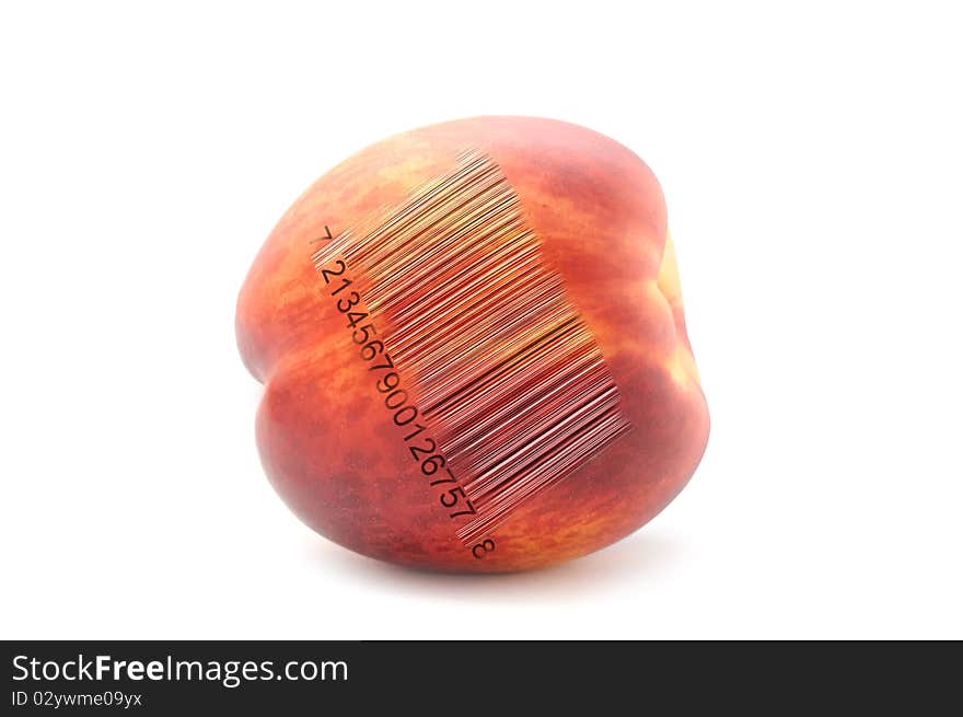 A peach with a bar code isolated on a white background. A peach with a bar code isolated on a white background