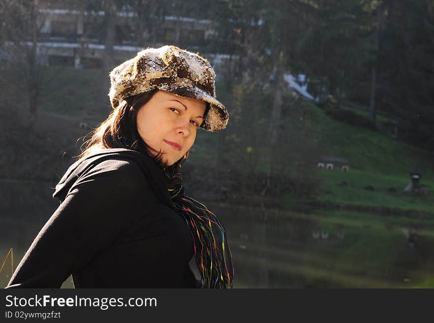 Girl in the autumn park near the lake