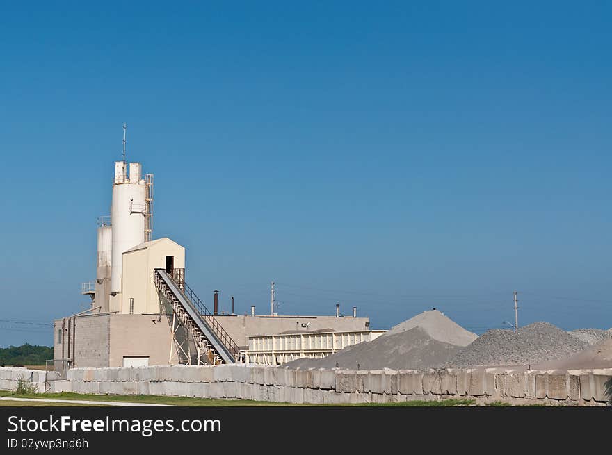 A concrete manufacturing plant with blue sky. A concrete manufacturing plant with blue sky.