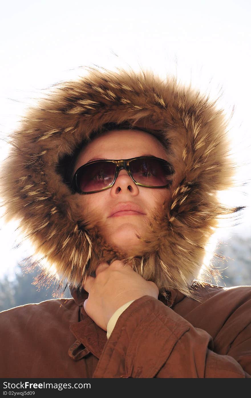 Beautiful woman in winter fur coat