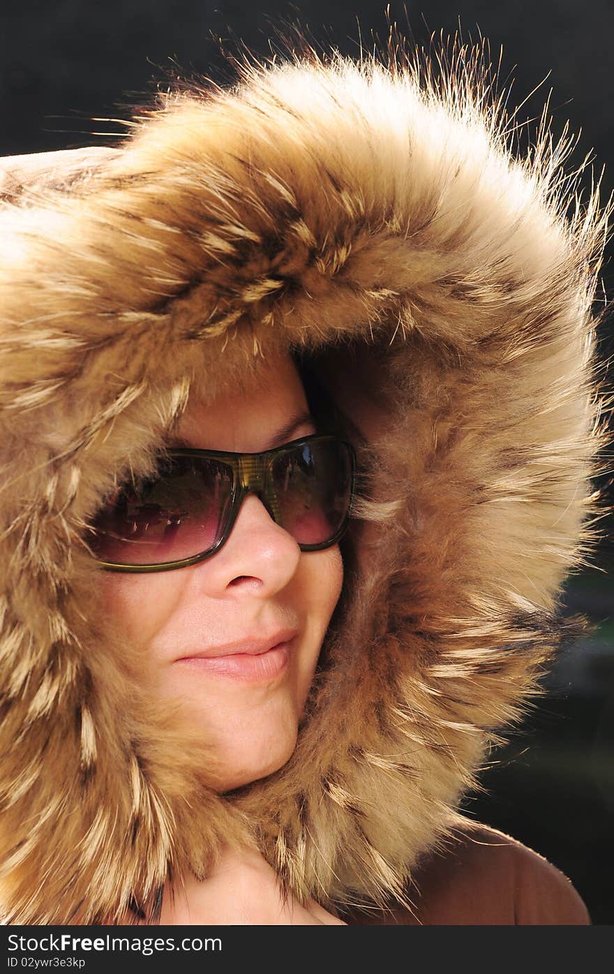 Beautiful woman in winter fur coat