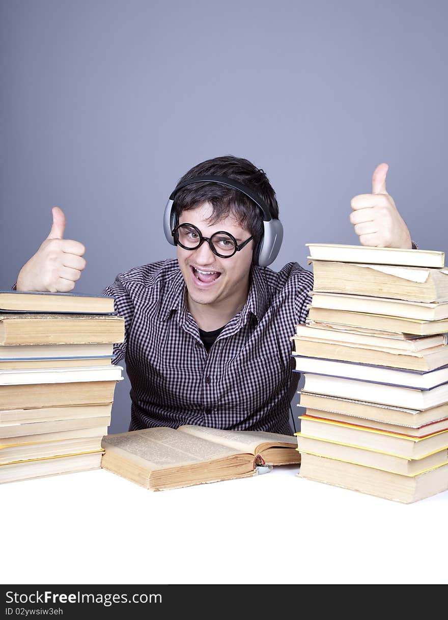 Student with the books and headphone isolated.