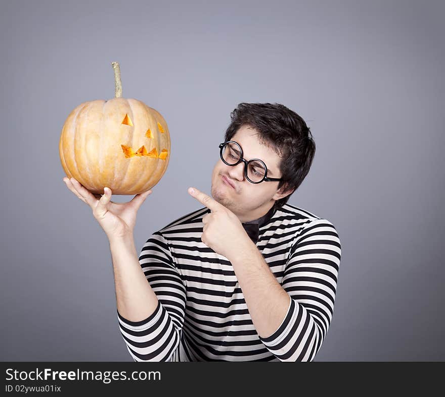 Funny mad men kepping pumpkin.