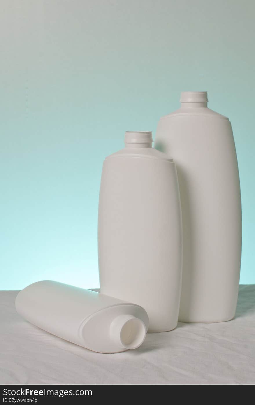 Three white plastic bottle without cap. Three white plastic bottle without cap