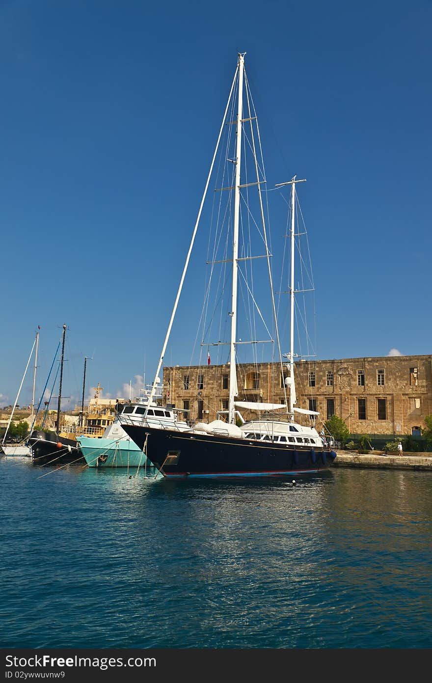 Luxury private yacht docking in the harbour