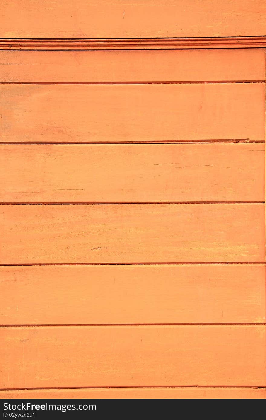 The orange wood wall of middle age house in Bangkok.