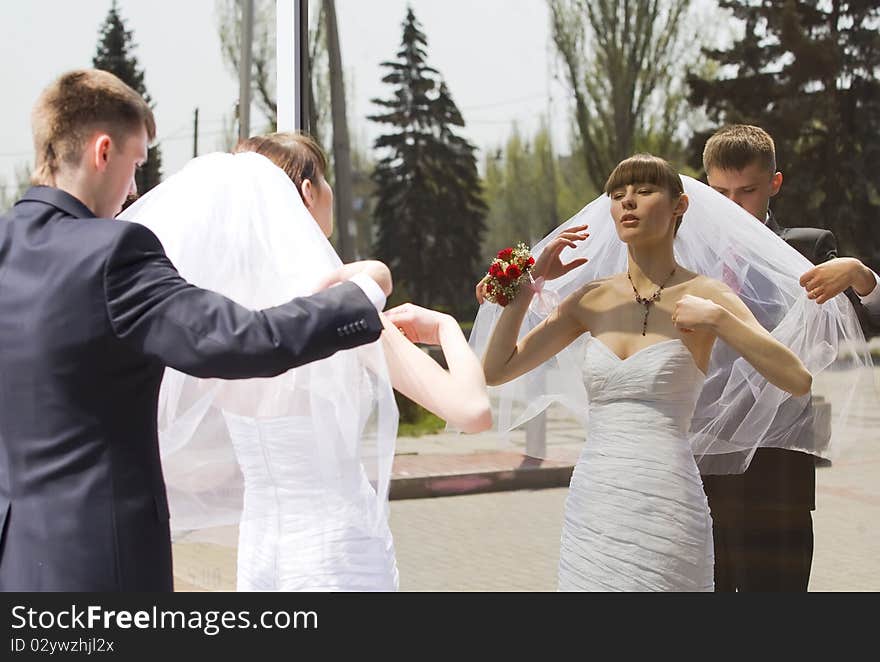 Bride And Groom By The Mirror Outdoor