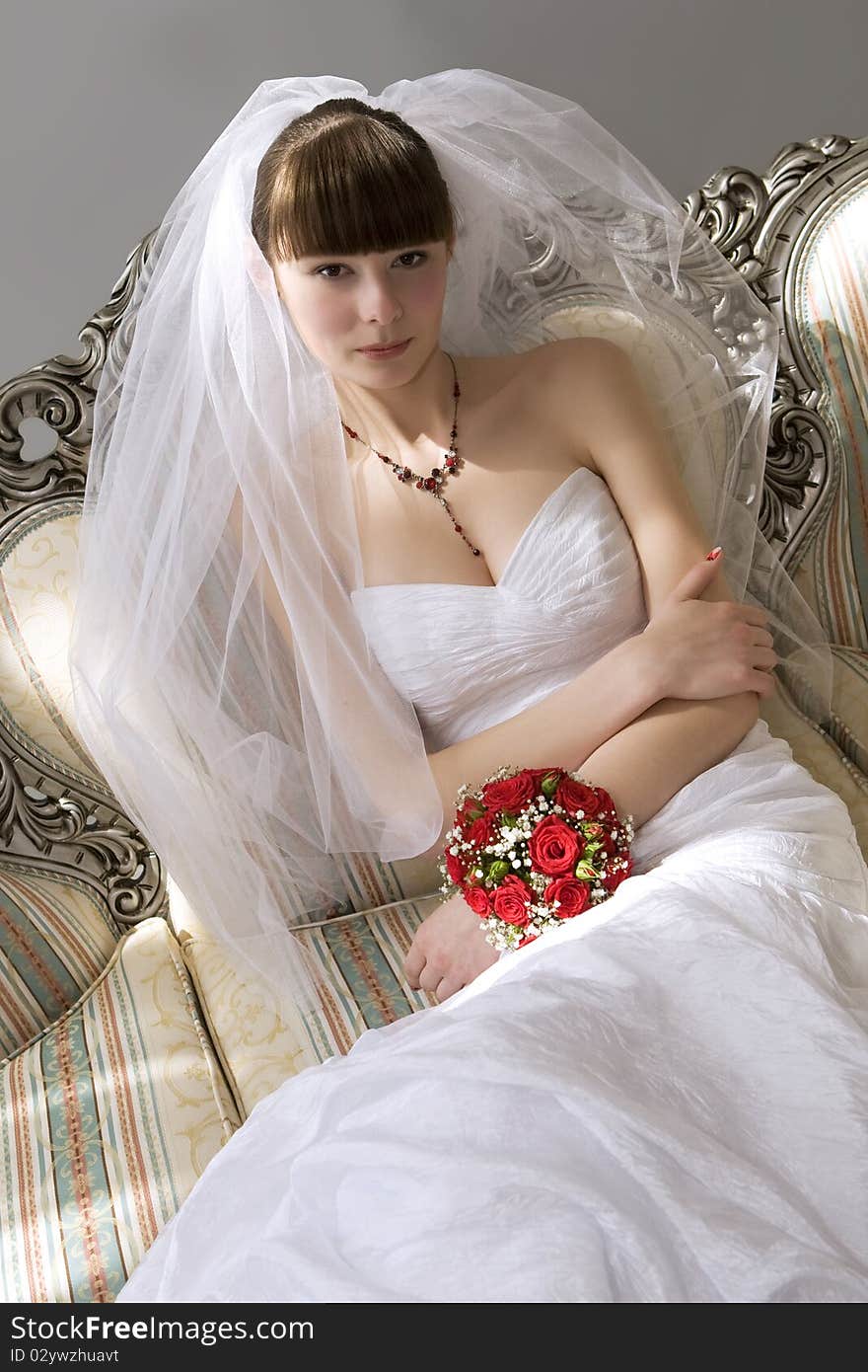 Bride sitting in luxury interior