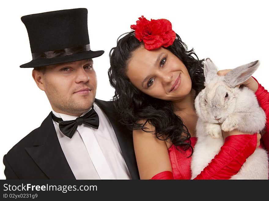 Closeup portrait of cute magicians with bunny against white background. Closeup portrait of cute magicians with bunny against white background