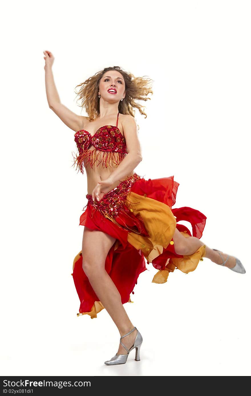 Girl in gipsy costume dancing over white background. Girl in gipsy costume dancing over white background