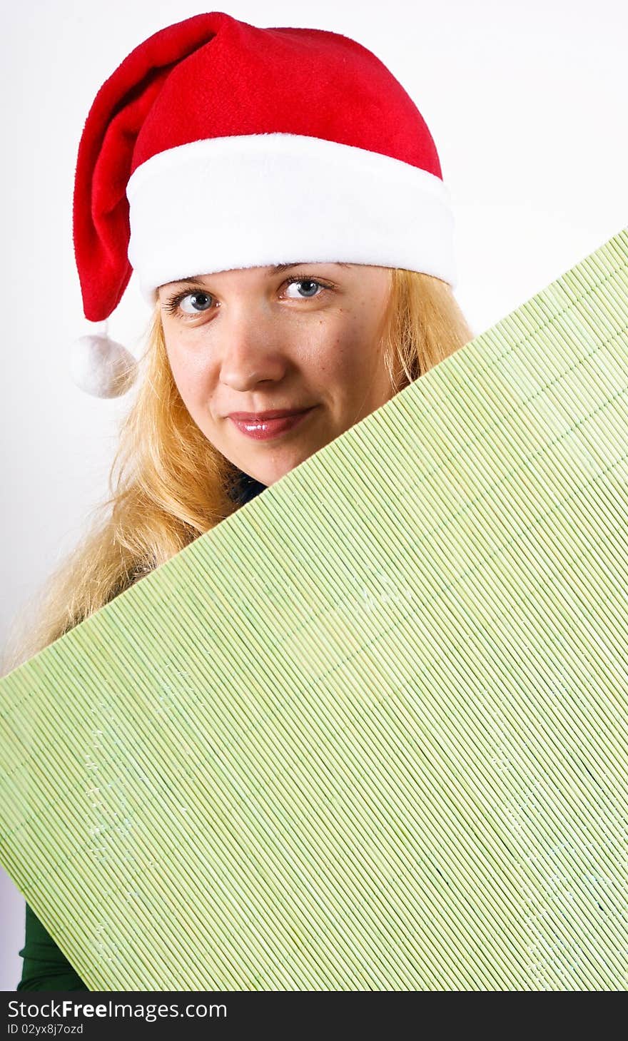 Girl holding green board over a white background