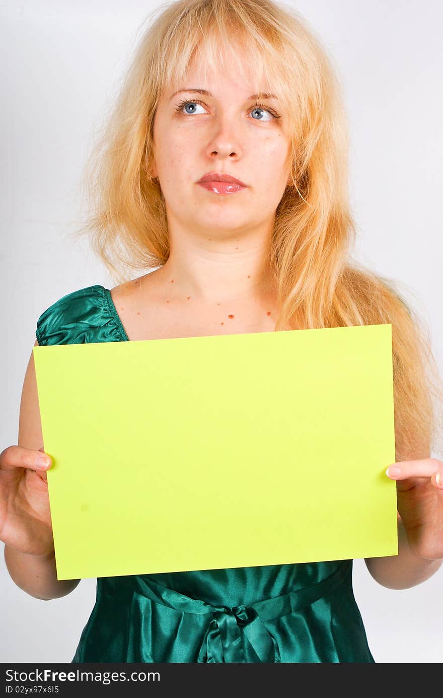 Blond woman holding a blank message paper