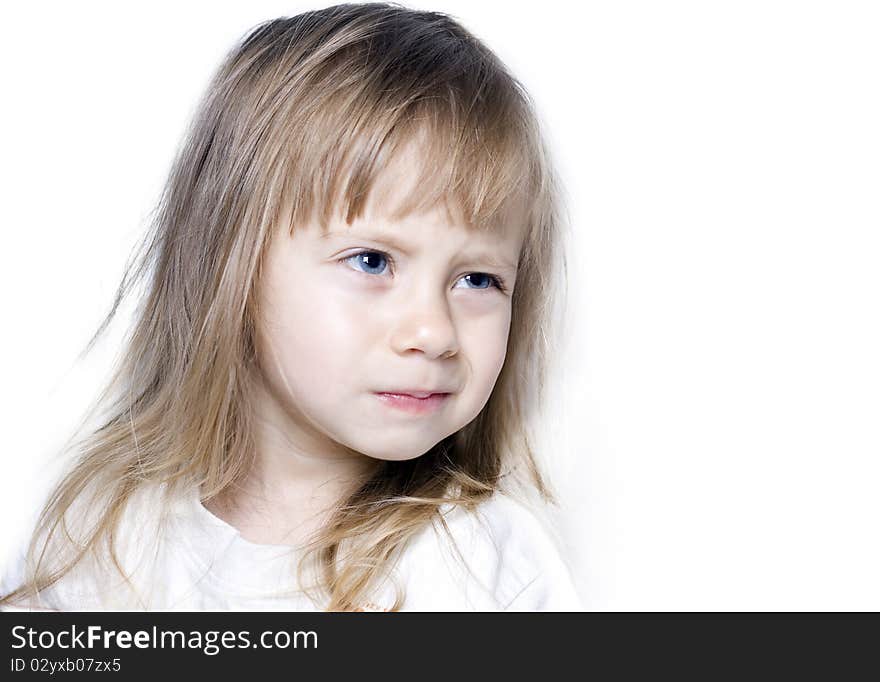 Cute young girl with a mischievous look on his face isolated on a white background. Cute young girl with a mischievous look on his face isolated on a white background