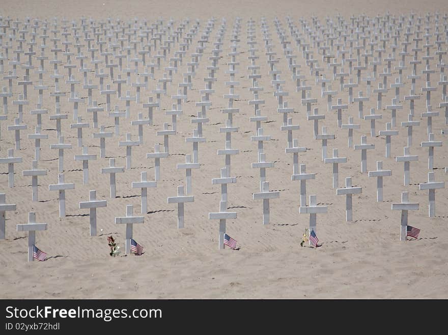 Wooden crosses in memory of fallen soldiers at war - Santa Barbara beach