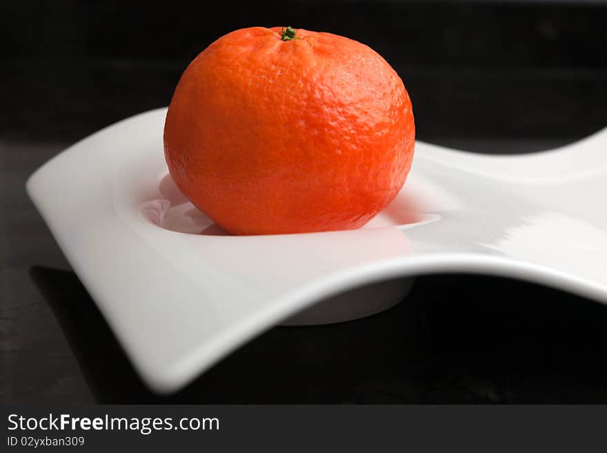 Tangerine on a original white plate.