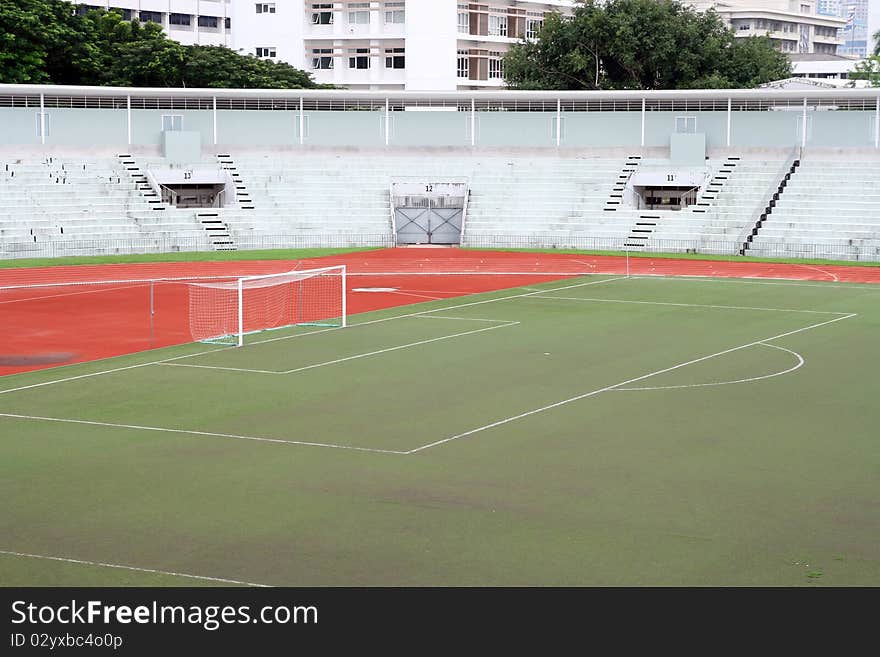 Soccer football goal with penalty area on fake grass pitch