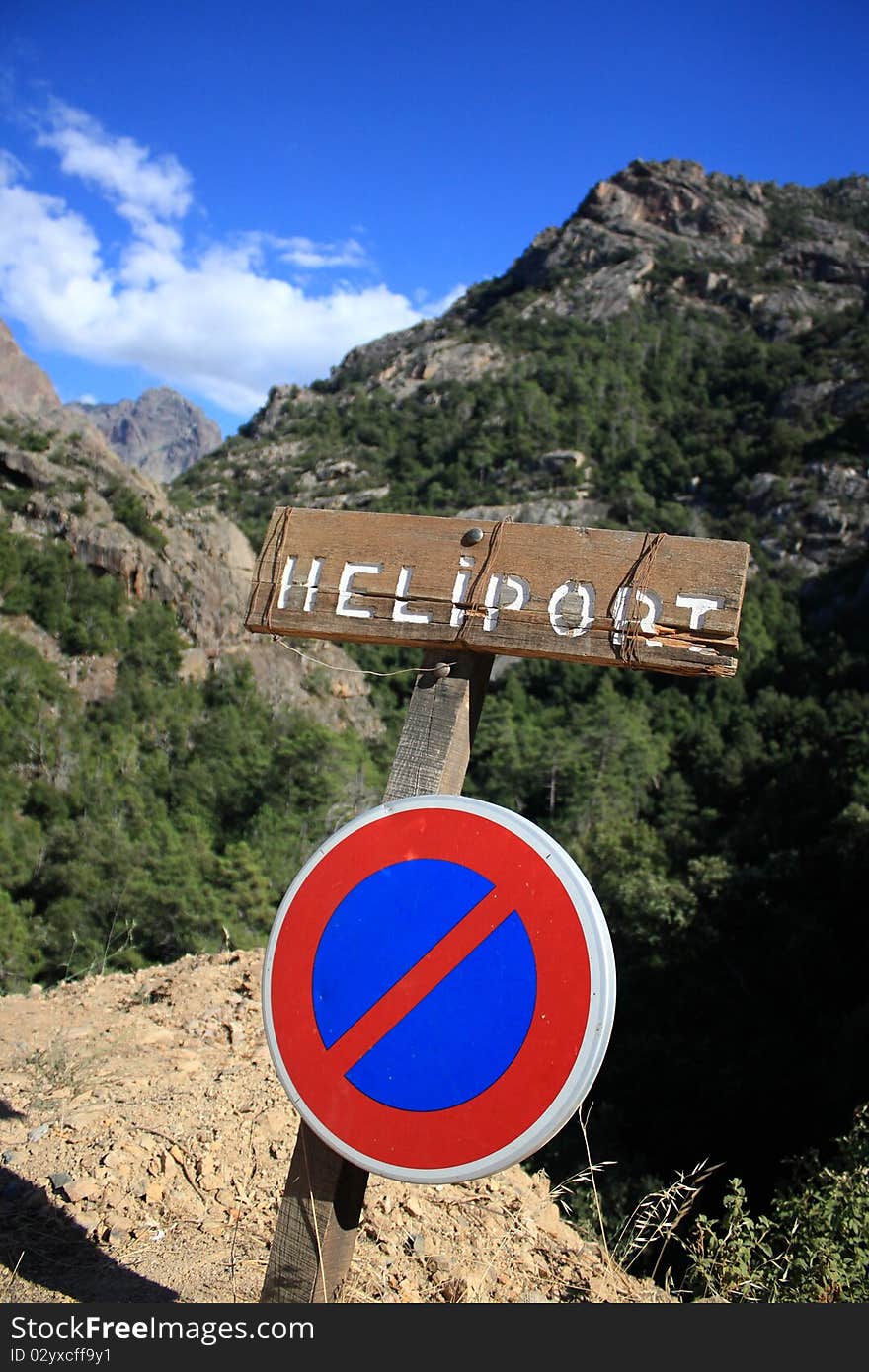 Wooden Heliport Sign In The Middle Of Mountains