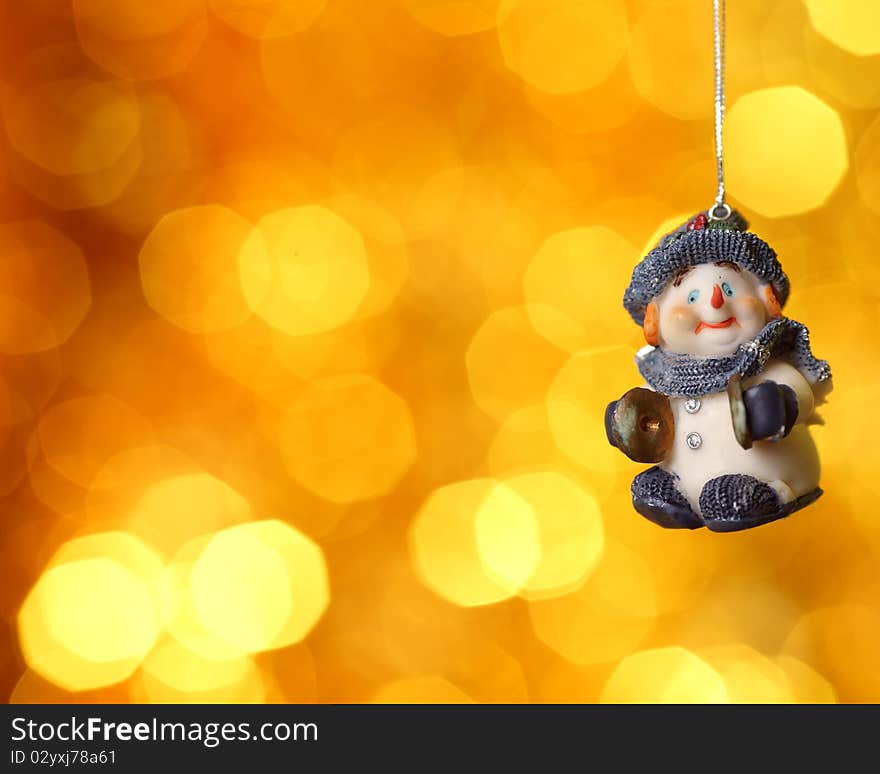 Christmas tree decoration against gold blurred background. Christmas tree decoration against gold blurred background