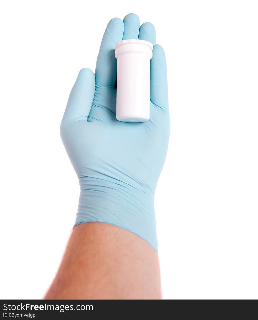 Doctor in blue gloves holding pills