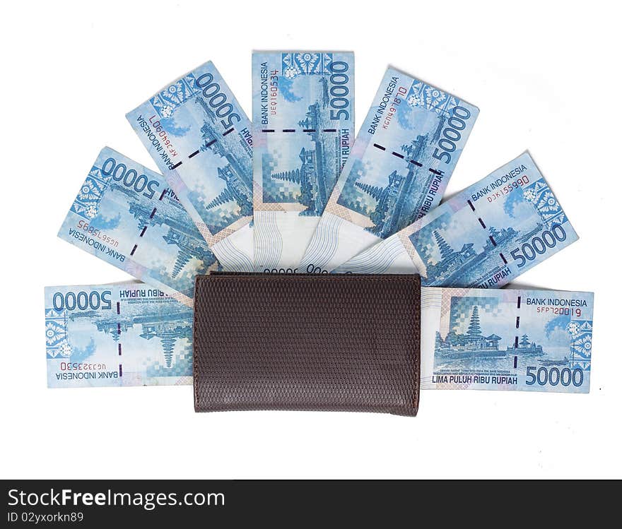 Still life photo of wallet and money over white background