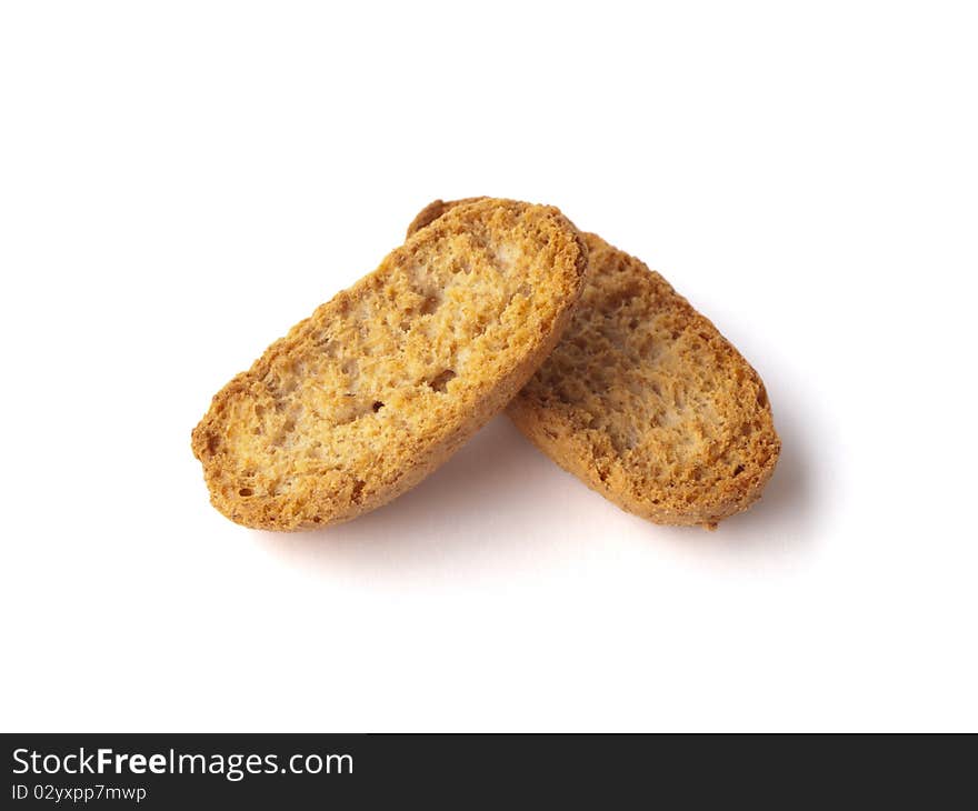 Two pieces of dry bread on a white background