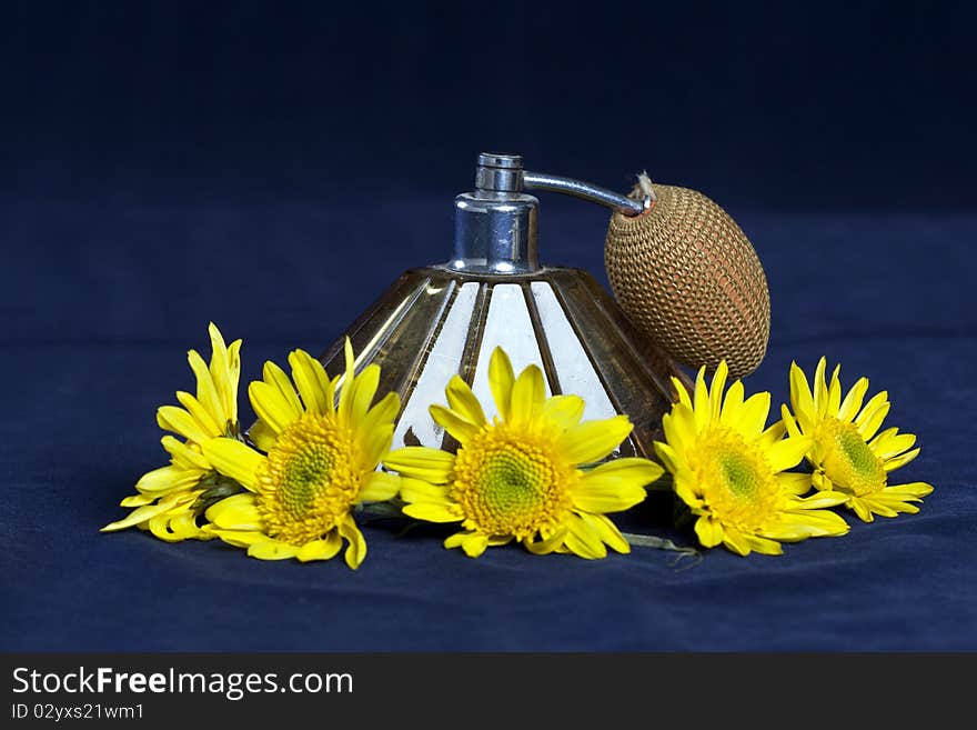 Vintage perfume sprayer with yellow flowers