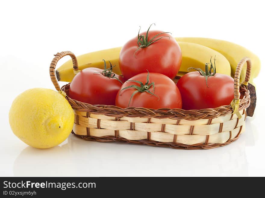 Ripe fruits and vegetables against the white background