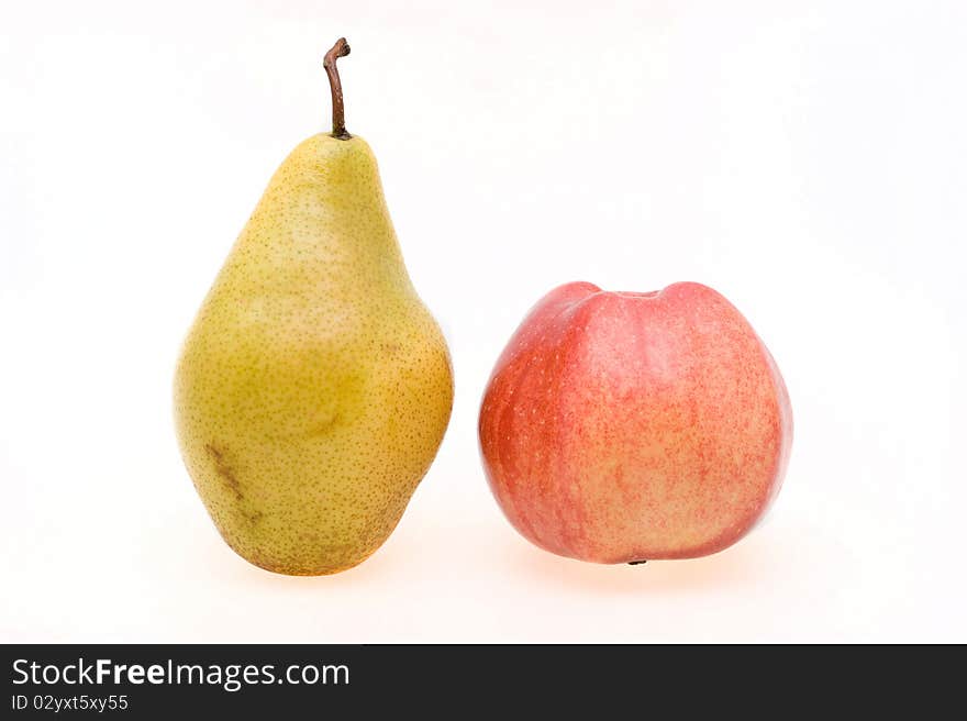 Fresh ripe apple and pear close-up on a white background. Fresh ripe apple and pear close-up on a white background