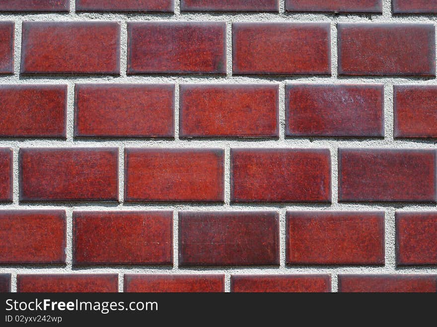 Highly-detailed dark-crimson tiled wall background