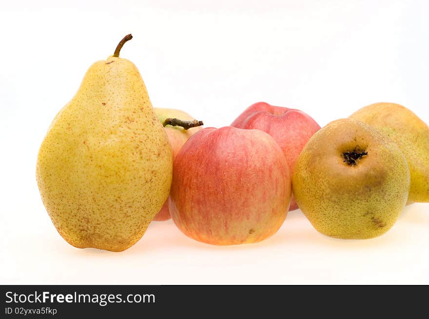 Fresh ripe apples and pears close-up on a white background. Fresh ripe apples and pears close-up on a white background