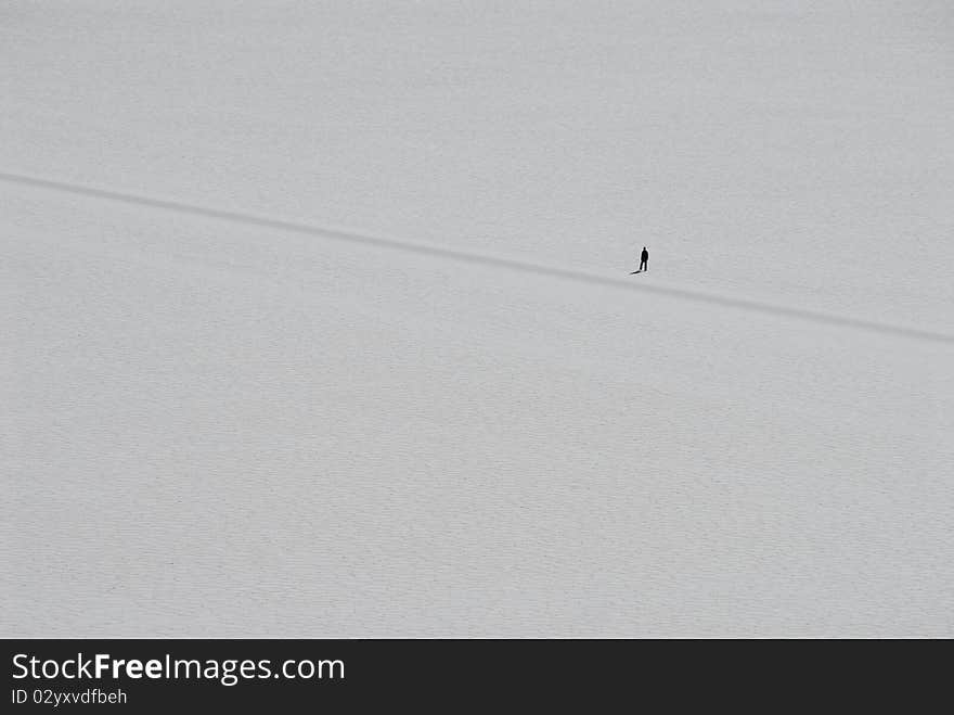 Lonely walker in Tunupa salt flats, Bolivia