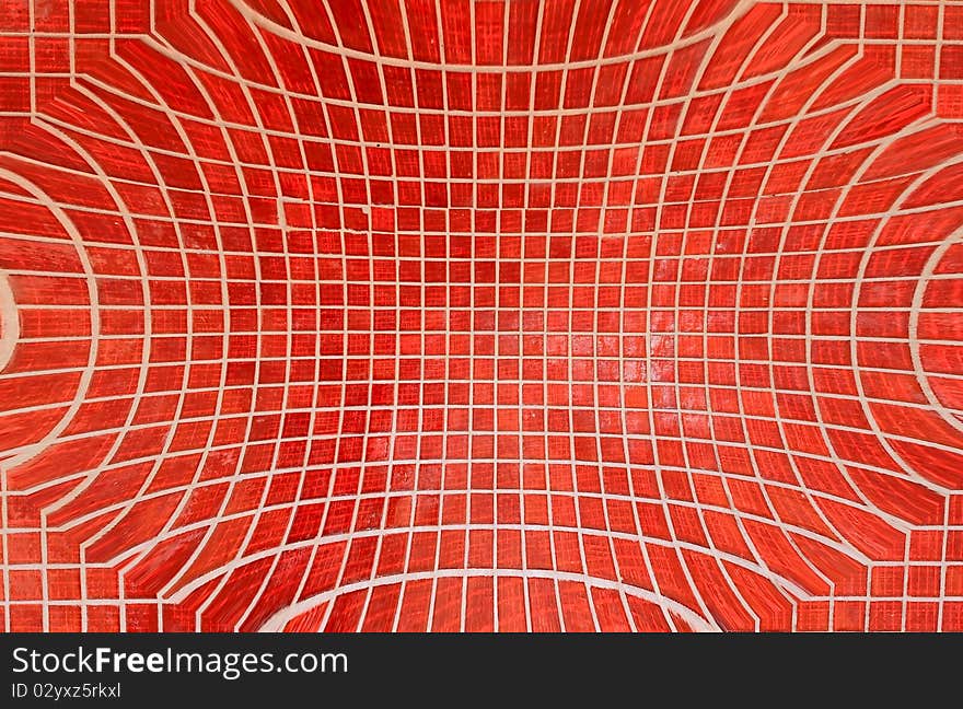 Closeup of a wall decorated with Murano glass mosaic tiles in red. Closeup of a wall decorated with Murano glass mosaic tiles in red