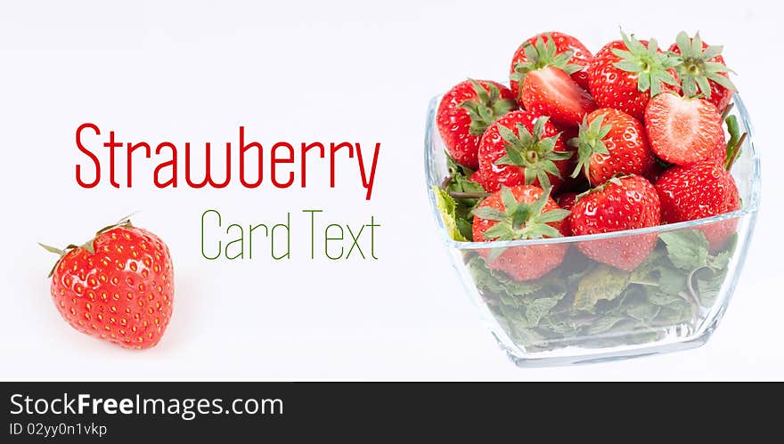 Strawberry with green leaf in the glass wase