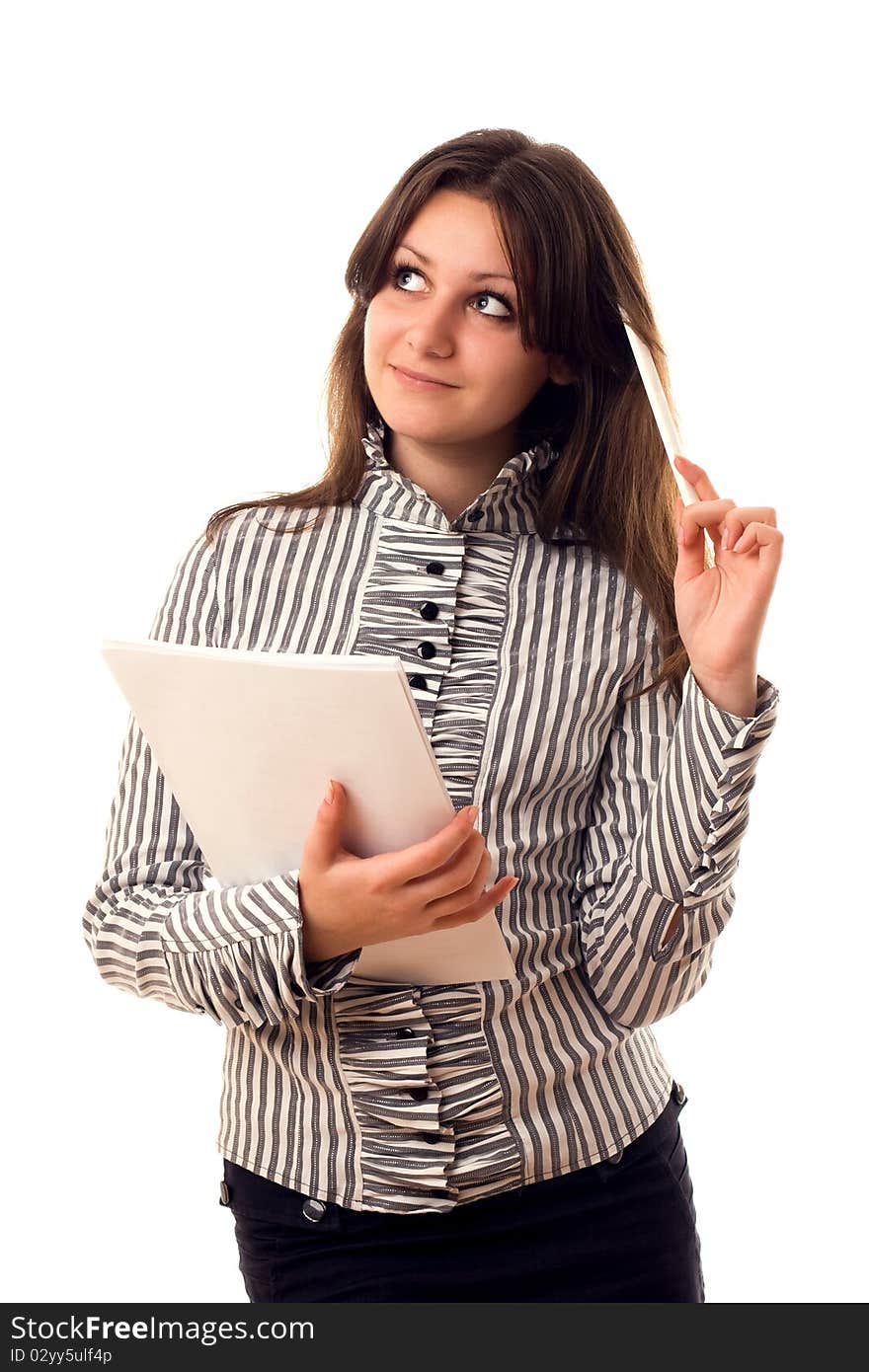 Beautiful girl with pen and paper thinking about something